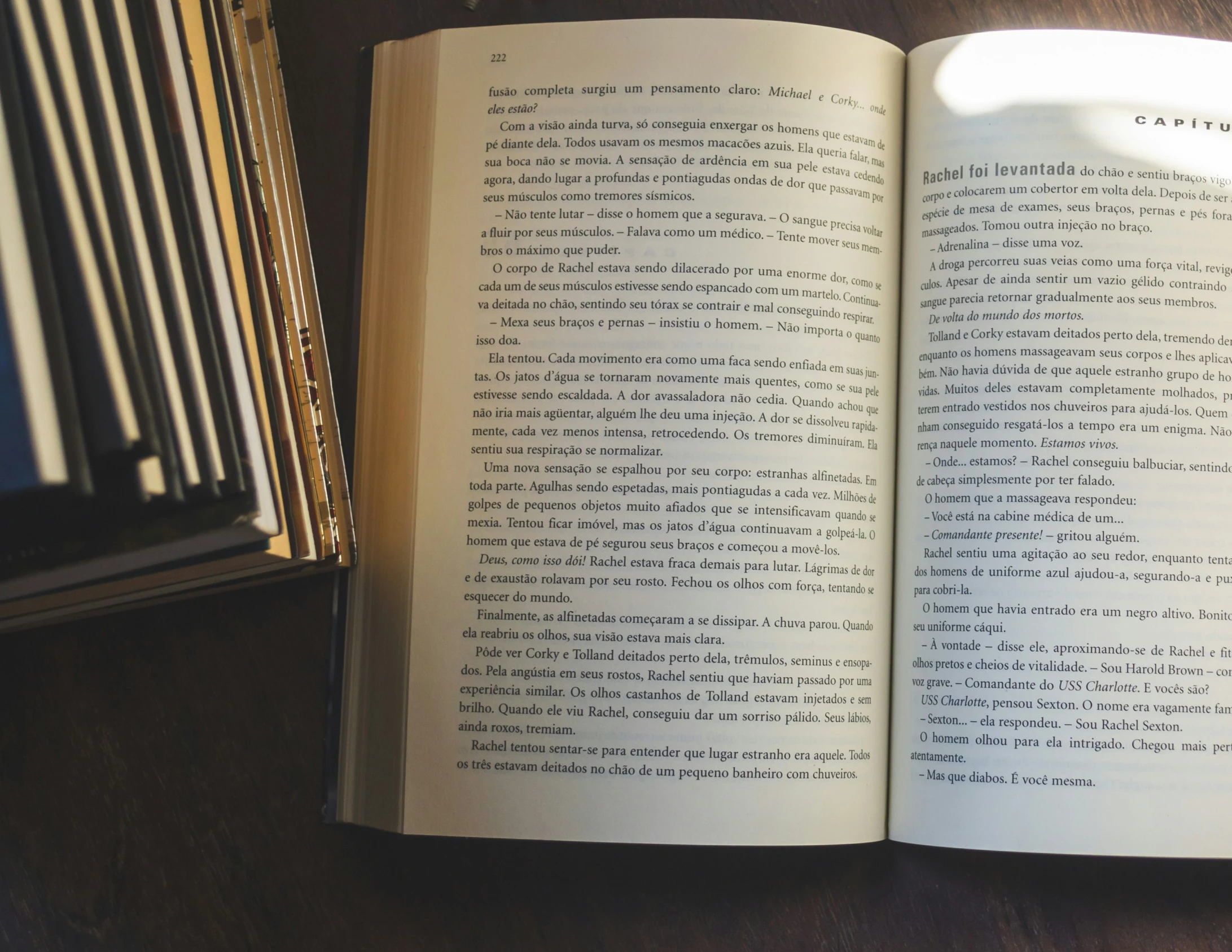 an open book sitting on top of a wooden table