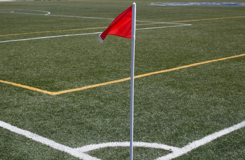 a flag is on the edge of a field