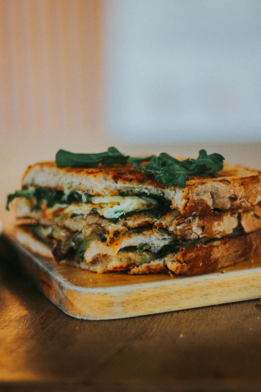 two slices of bread on a wooden  board