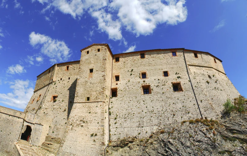 a tall castle with windows on the side