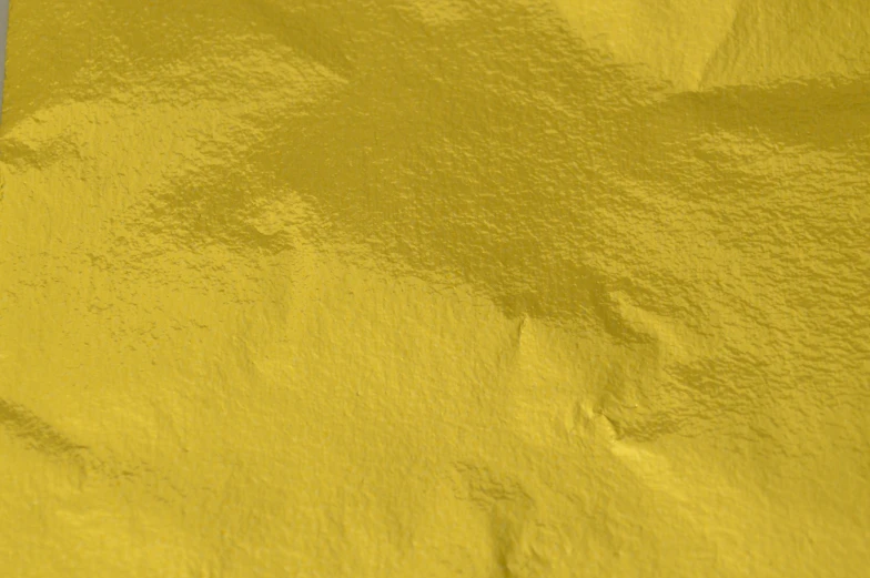 yellow colored background with little scratches of paint