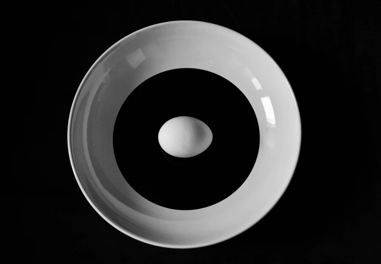 the white bowl has a black background