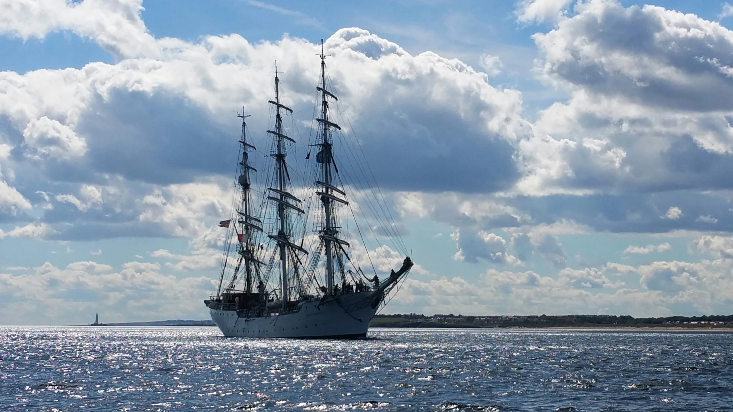 a sailboat is sailing on the open water