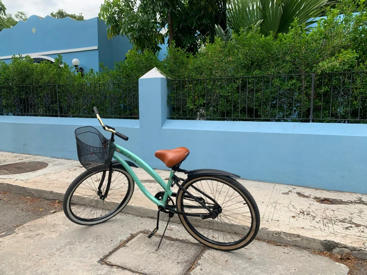 there is a bike parked next to a wall