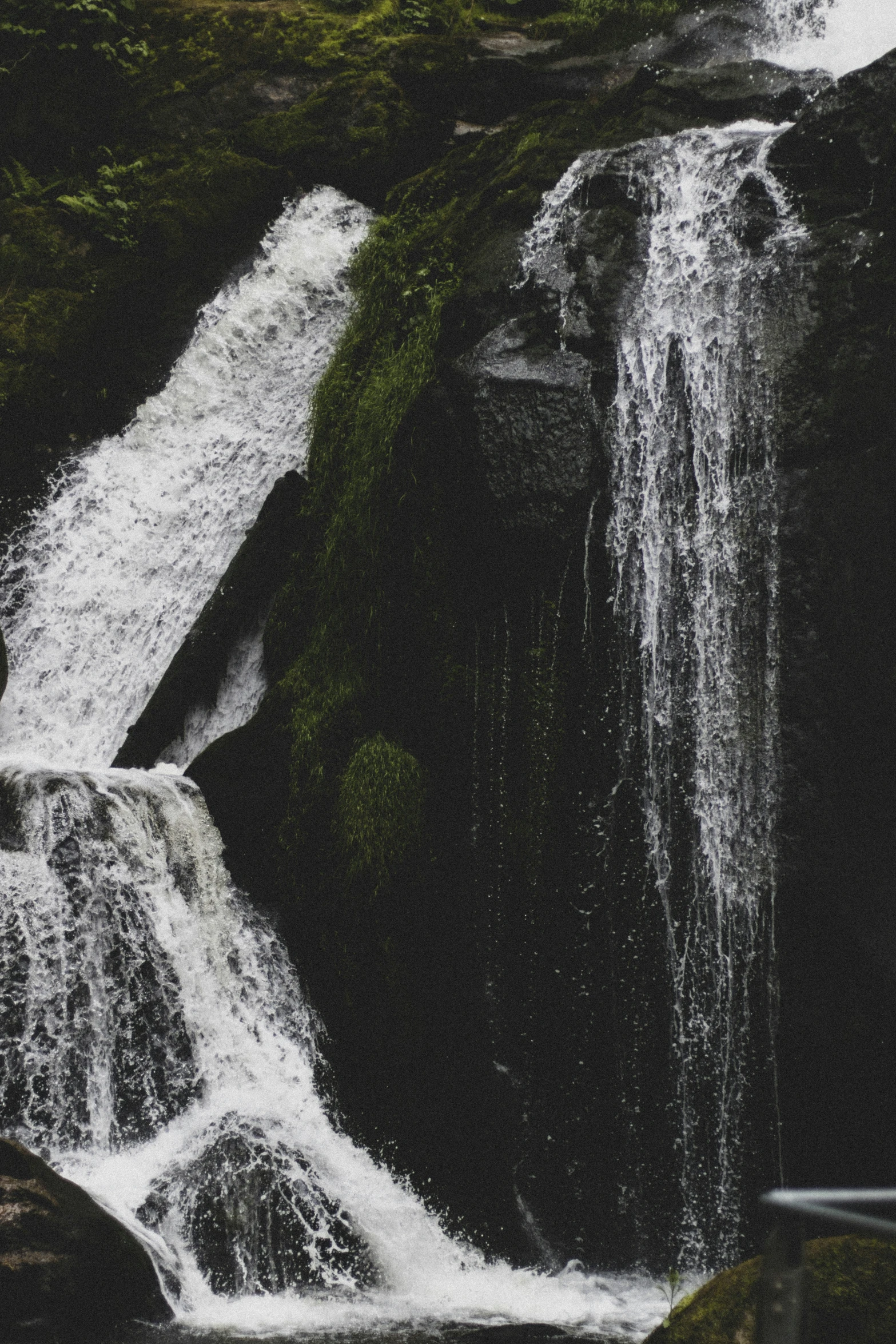 an image of waterfall with water in the foreground