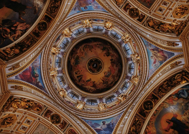 the ceiling in the palace has many paintings on it