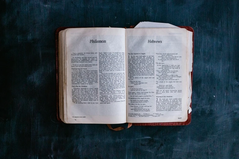 a bible open with text on the inside of it