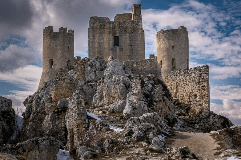 the tall castle has been built on a rocky cliff