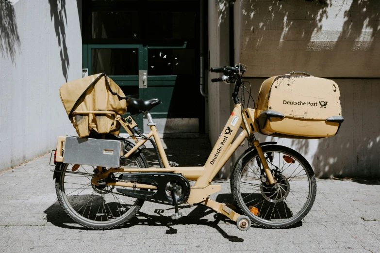 a bicycle with baskets strapped to the handlebars