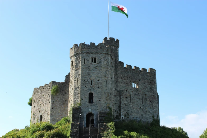 a large castle is shown on the hill