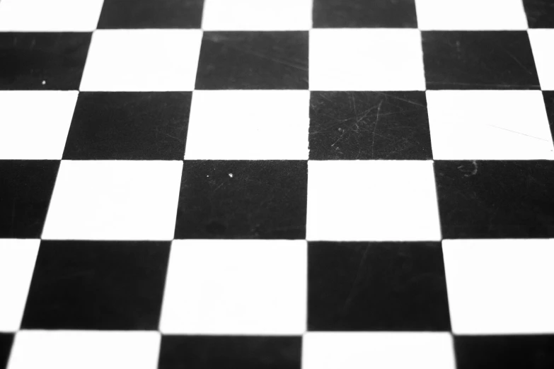 a white and black checkerboard table that appears to be made of wood or plastic