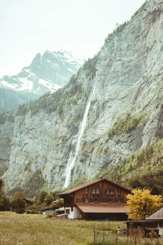 a beautiful view of a mountain side waterfall