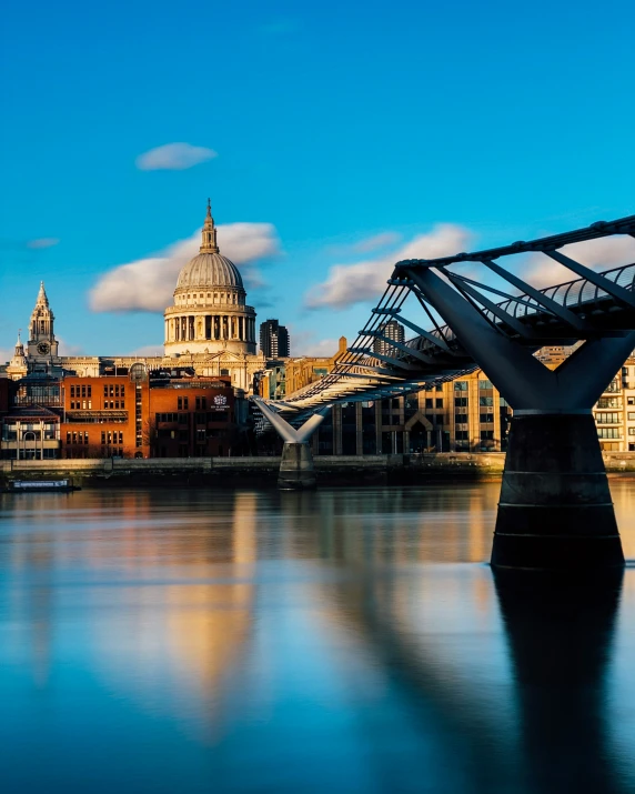 a long bridge leading over to a city