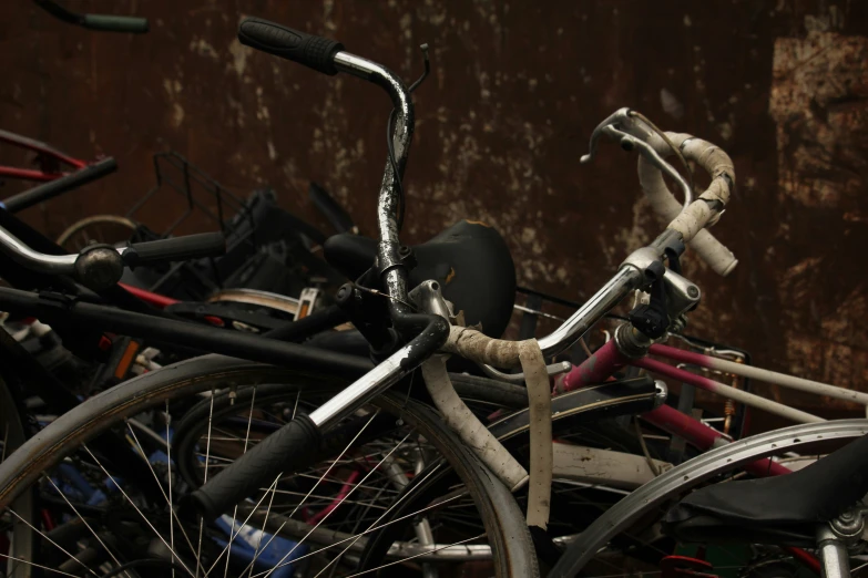 a pile of bicycles that are all in various different colors