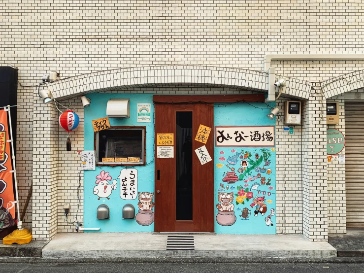 a colorful building has two doors that are closed