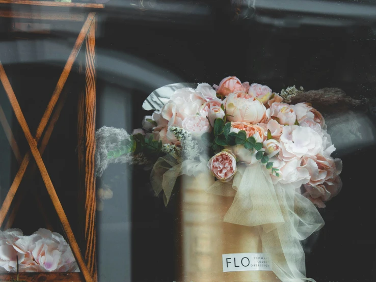 the flowers are sitting on the table next to a bag