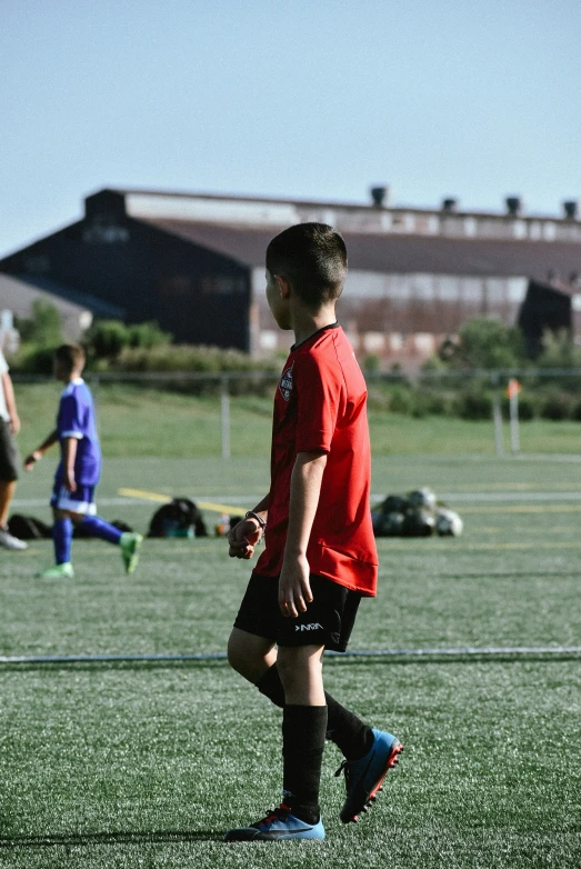 a  is in the field playing soccer