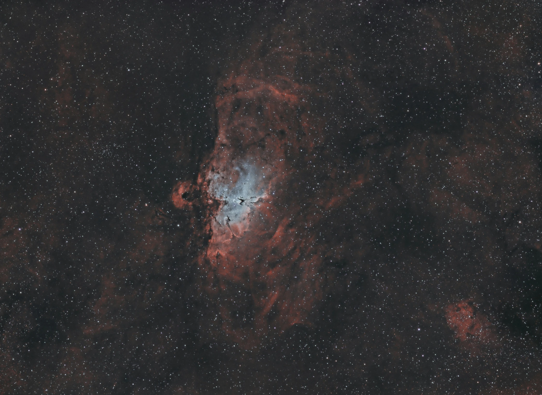 an open view of the andromidene cloud cluster, with stars around