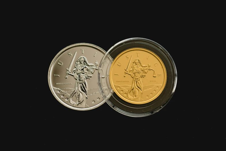 two coin with a person holding a sword