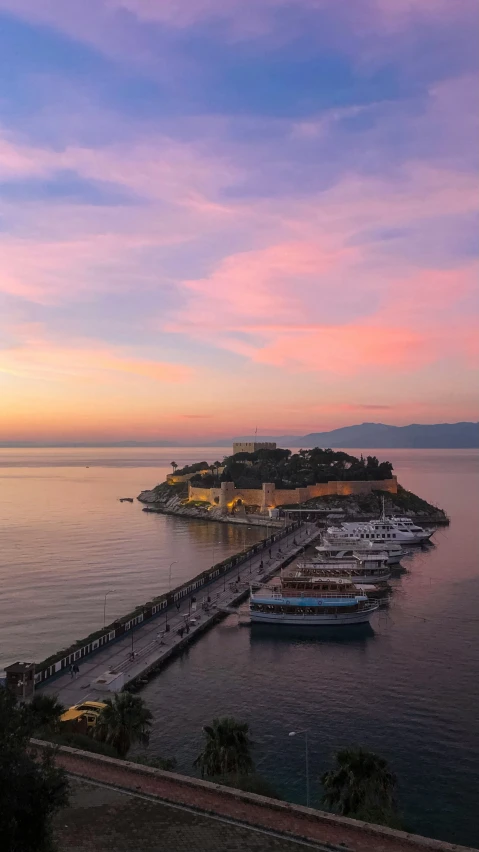 an empty pier in a bay at twilight