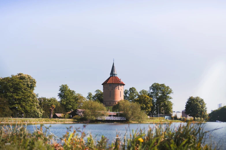 there is a large tower next to the water