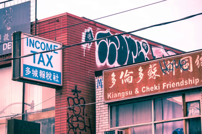 a large sign for an asian and chinese tax