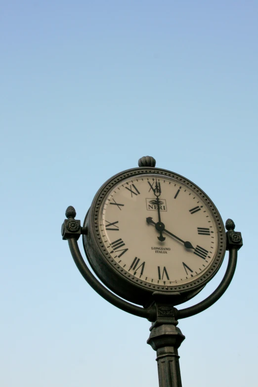 a clock showing the time on a clear day