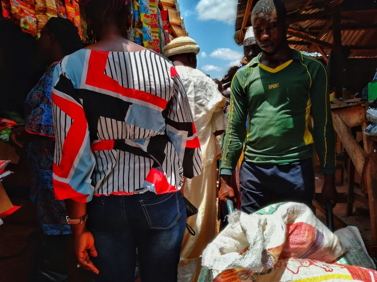 the men are walking by the baskets that have been kept