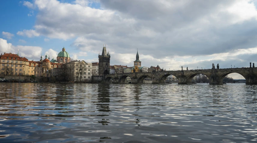 a view of some water with a bridge