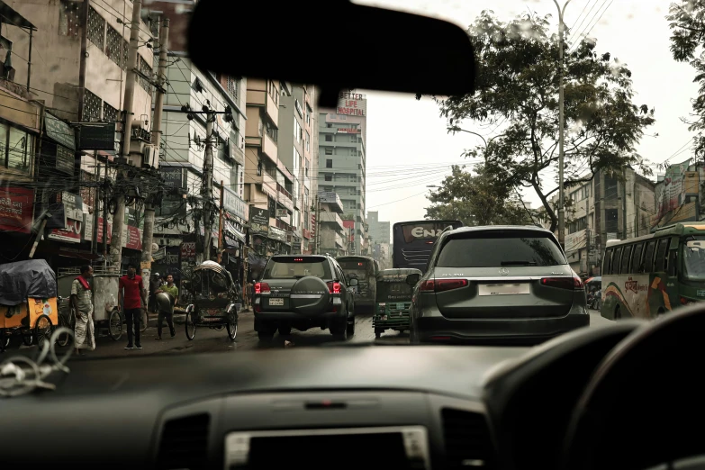 traffic in an asian city with bicycles and cars