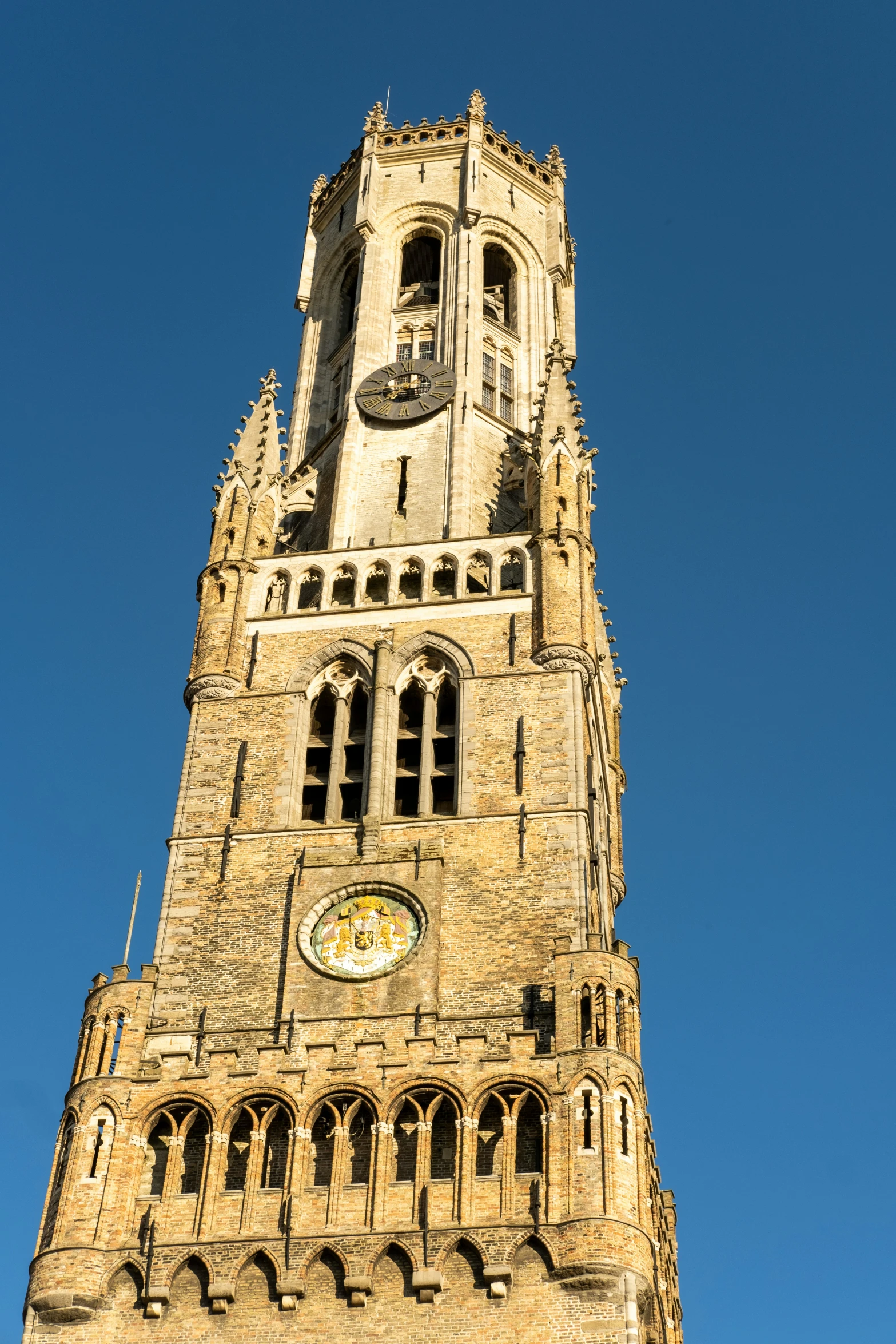 a tall clock tower with a clock on each side of it