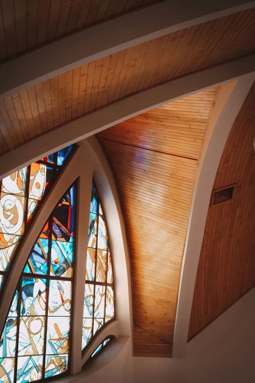 some fancy stained glass windows above some stairs