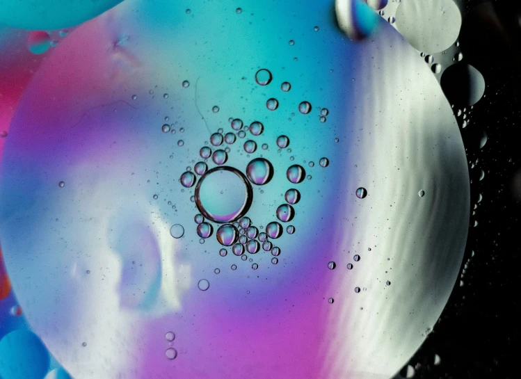 water drops and liquid shapes on a black background