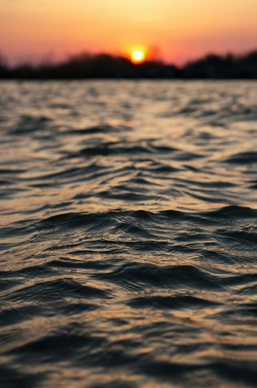 a view of the ocean, with waves in the water