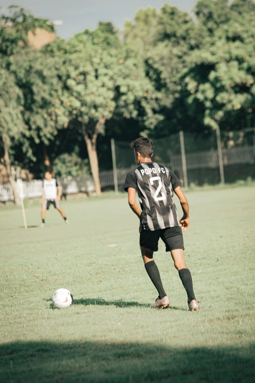 a  about to kick the ball