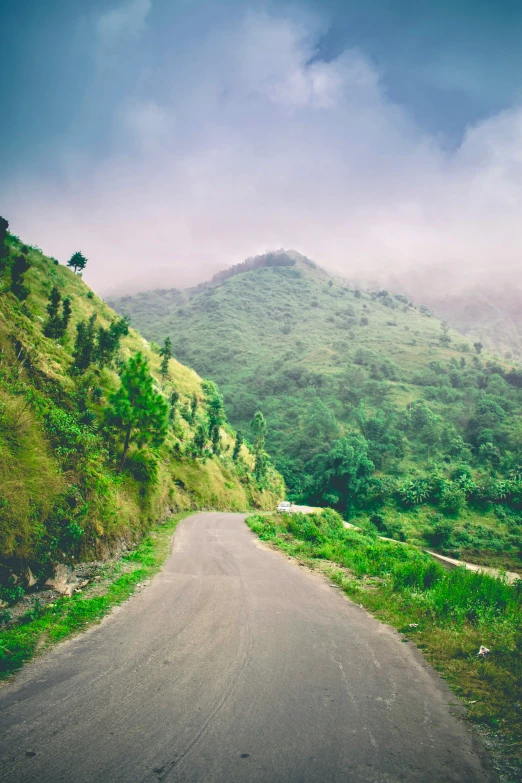 the view of a mountain road in a rural area