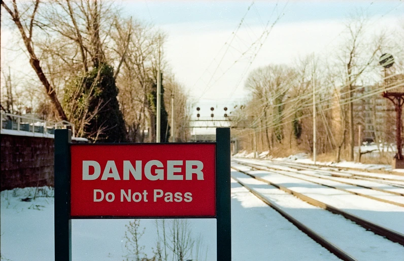 a sign warns of what to do when entering the station