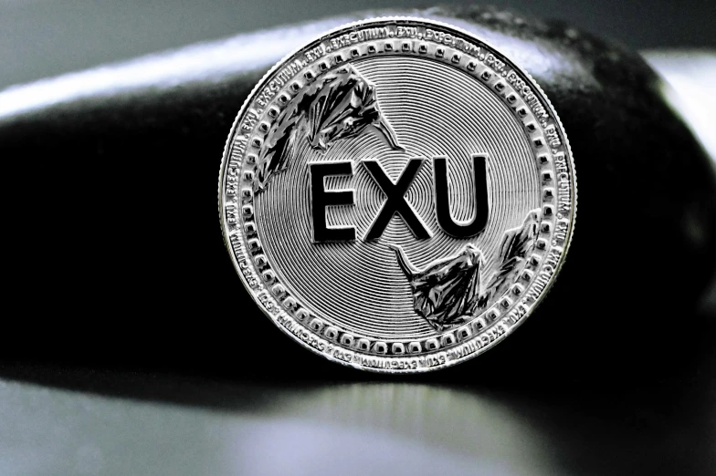 an exu logo is displayed in black and white