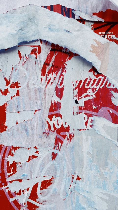 a red and white snowboard with red coca cola on it