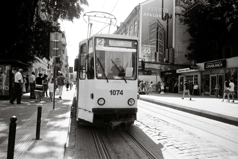 a small electric tram car on the tracks