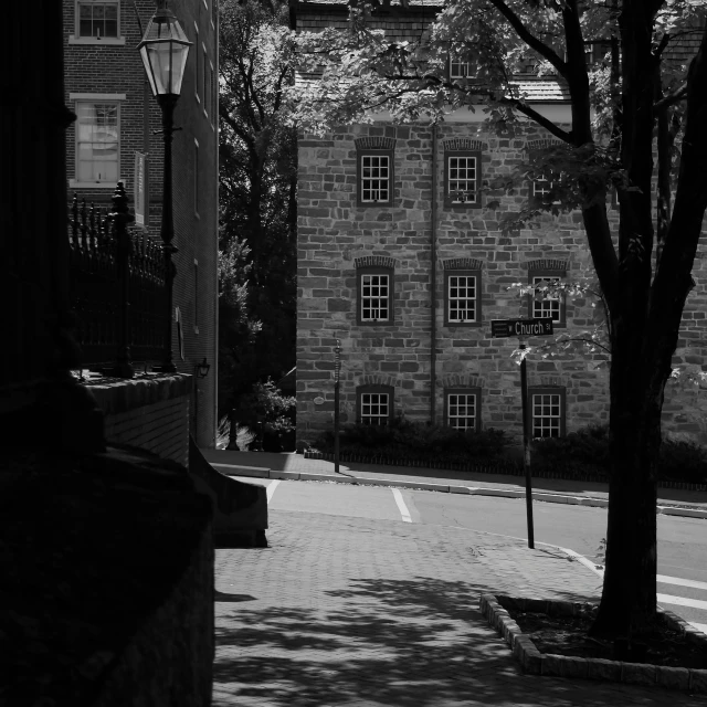 a brick building with some trees in front