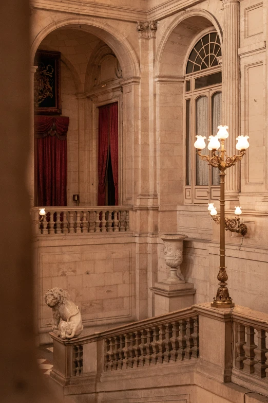 looking down a staircase at a beautiful building