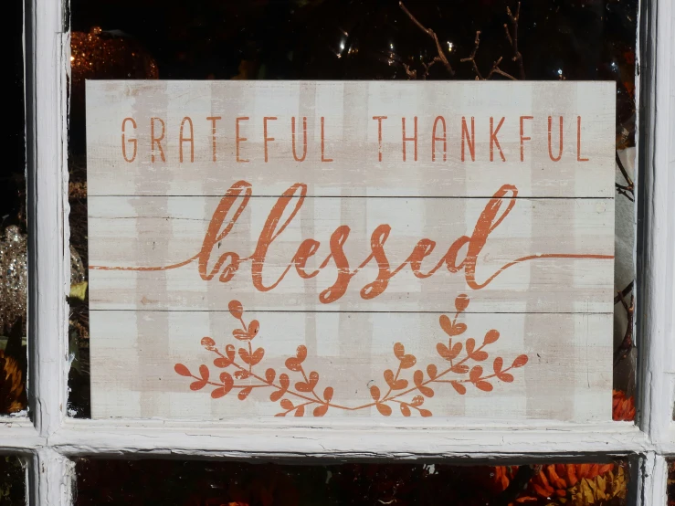 a wooden sign with the word grateful thanking of god and being alive