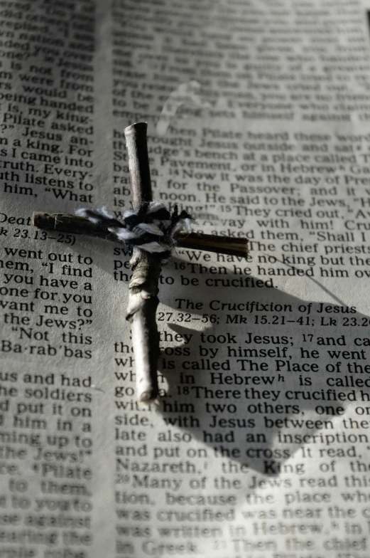 an image of cross that is made from newspapers