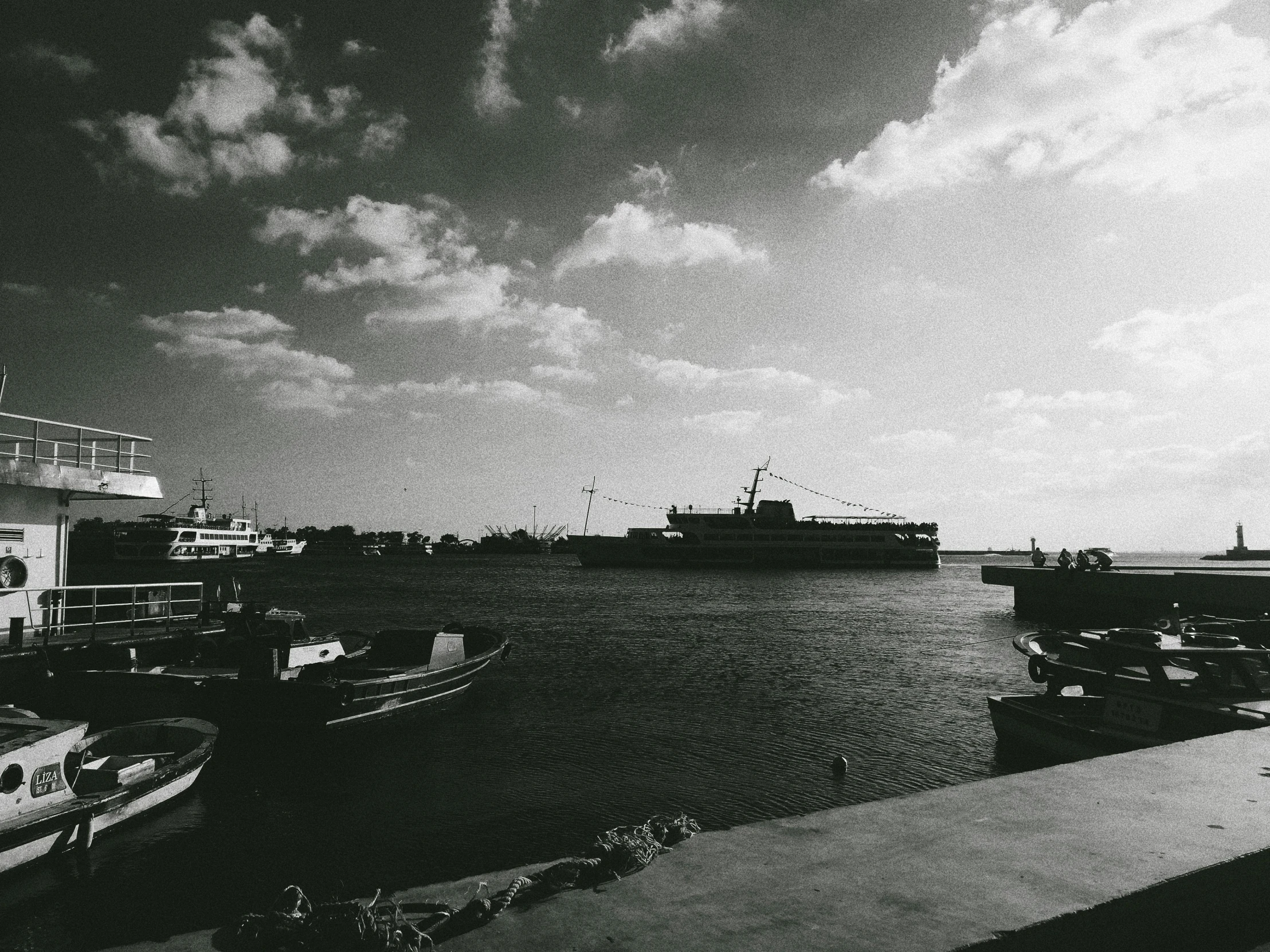 the ocean and ships have stopped in the dock