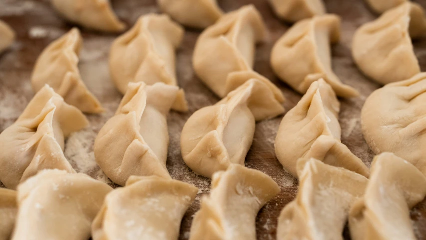 dumplings arranged on a counter ready for dinner