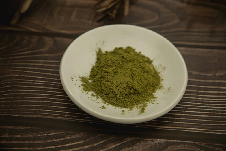 a small bowl full of green powder