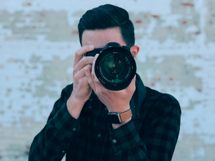 a man is taking a picture in his mirror