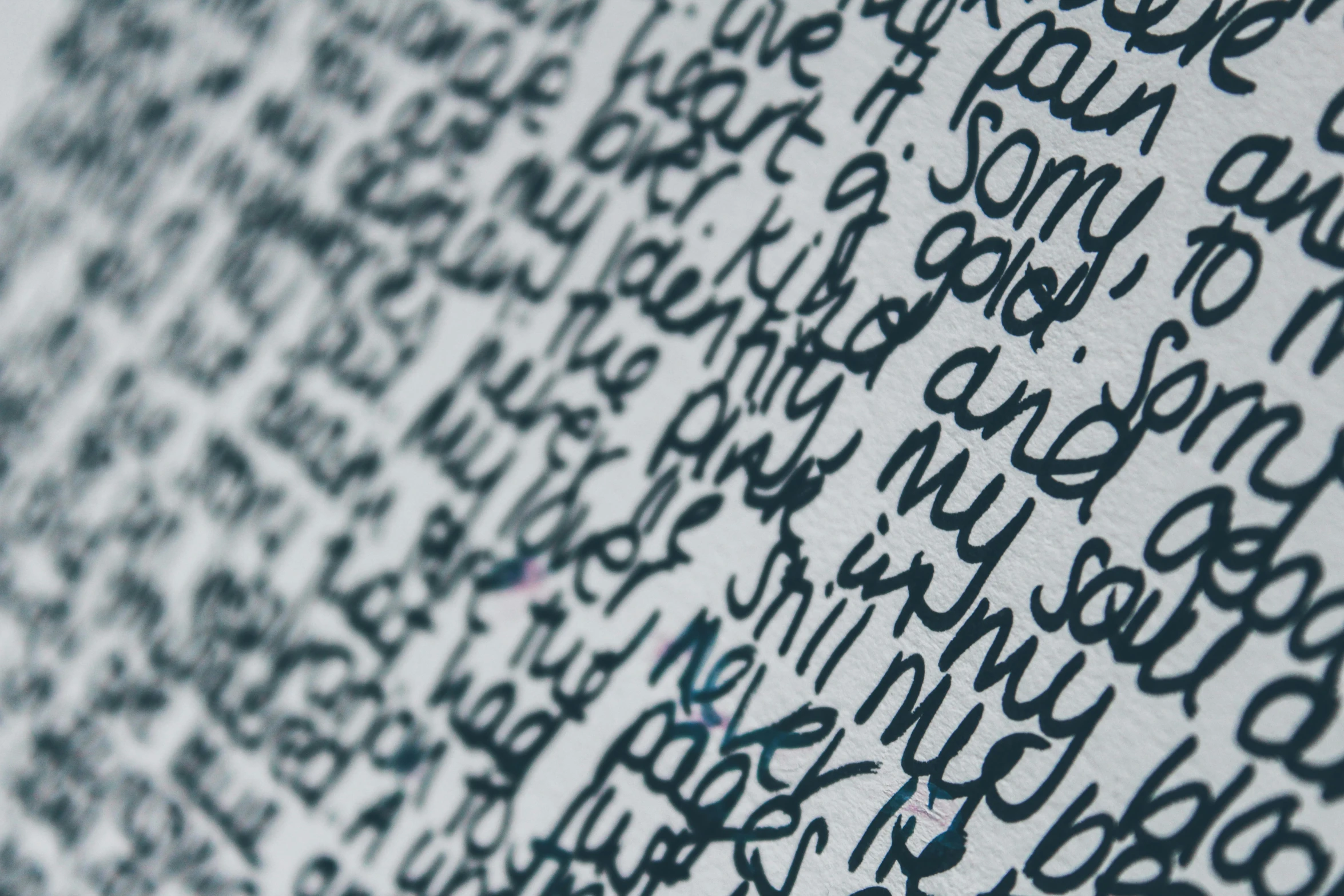 some words written in a writing pattern