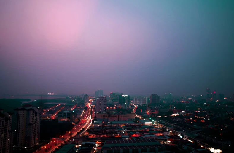 nighttime over a city with street lights and buildings